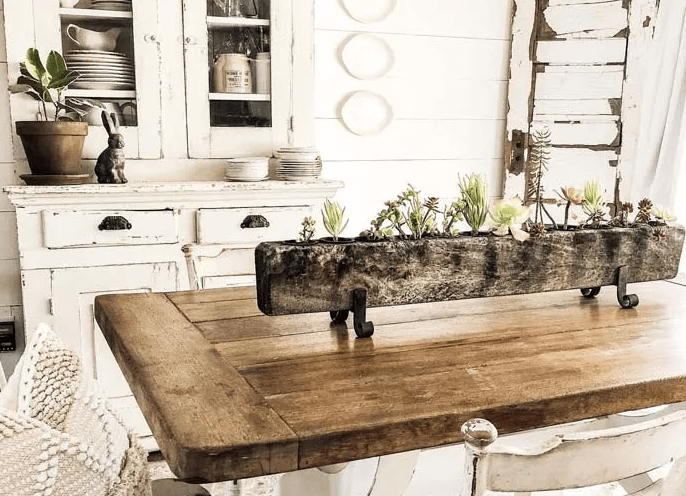 An elevated wooden planter on dining table